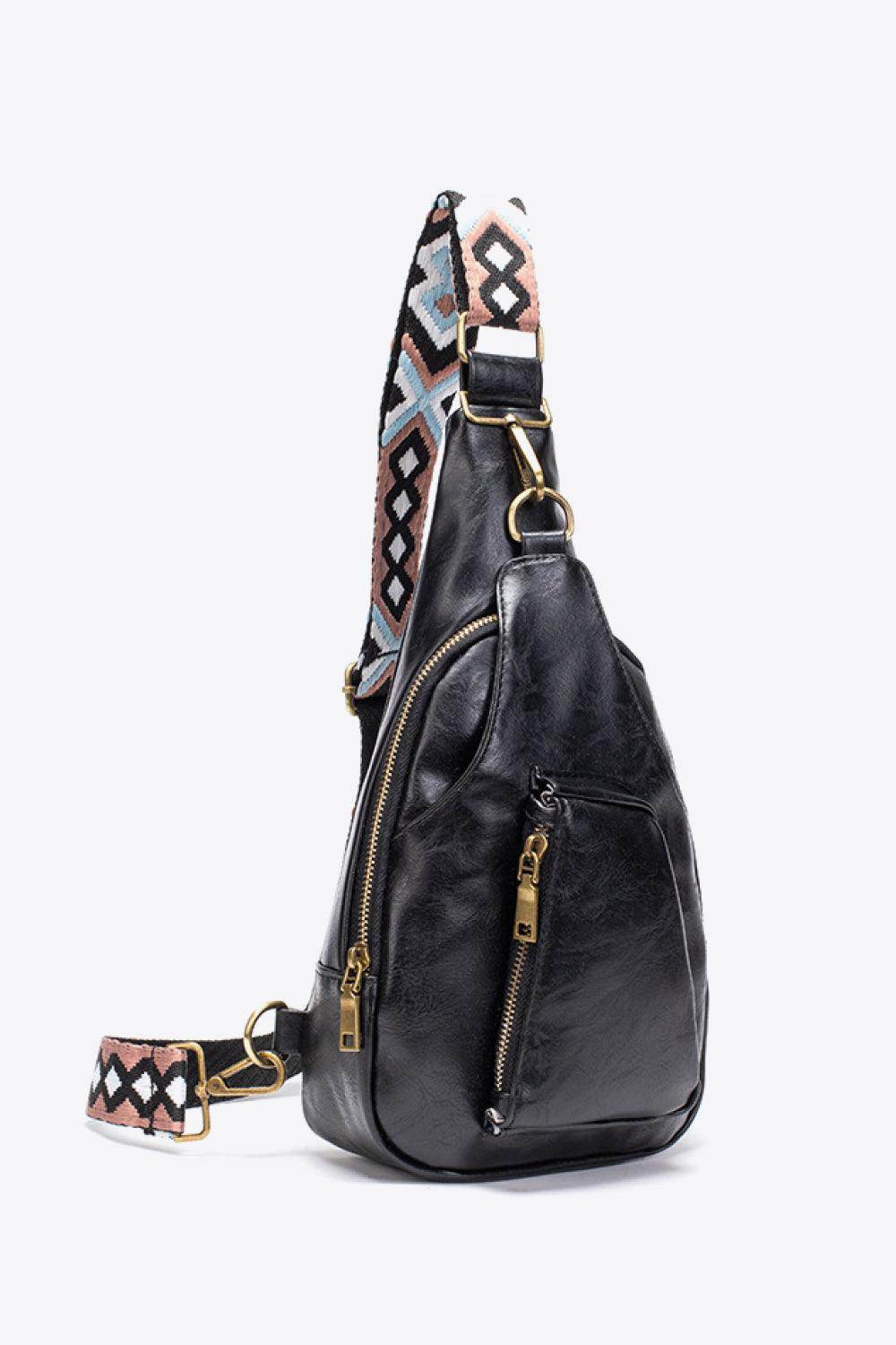 Stylish black sling bag with colorful strap and zipper pockets, featuring a pink PU leather sling bag design