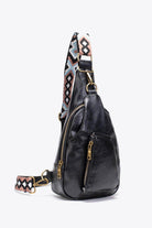 Stylish black sling bag with colorful strap and zipper pockets, featuring a pink PU leather sling bag design