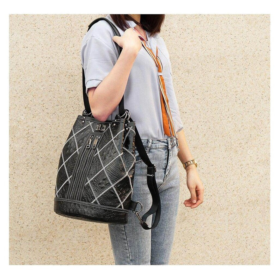 Stylish boho leather travel backpack with lined patterns and adjustable straps for trendy travelers