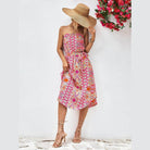 Trendsi boho style strapless dress in vibrant pink and orange pattern with a flowy silhouette