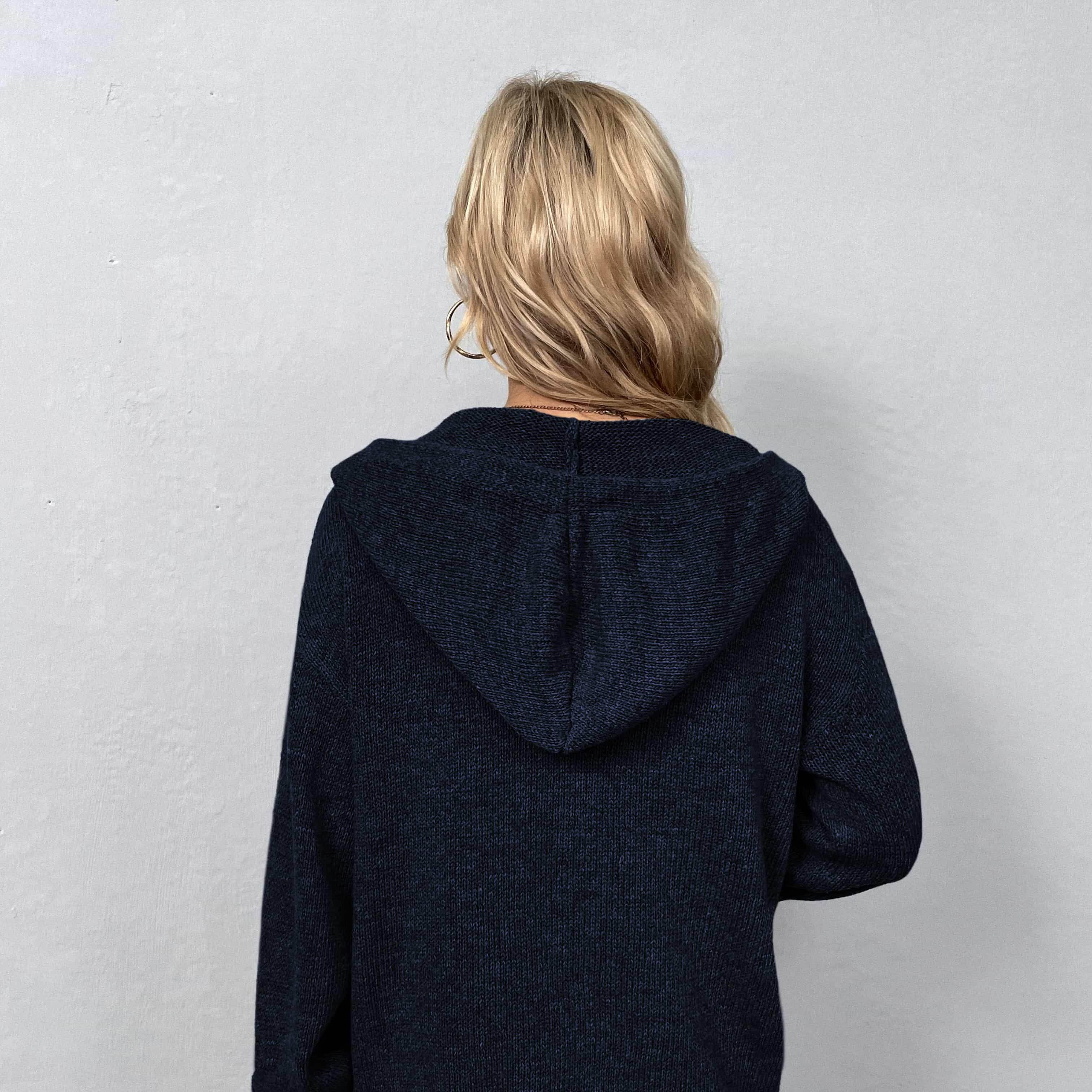 Back view of a casual hooded cardigan in navy blue, perfect for everyday outfits