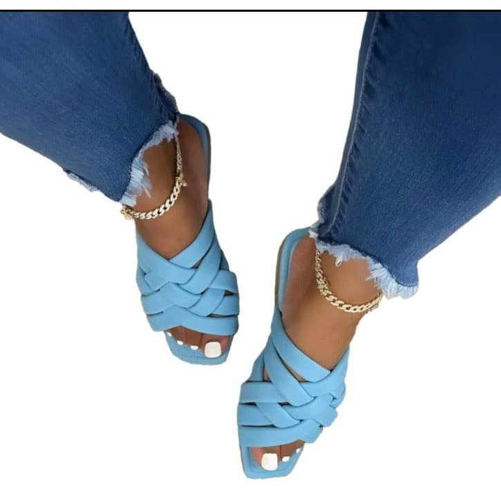 Light blue women's casual outdoor flat sandals with stylish cross straps and a modern design