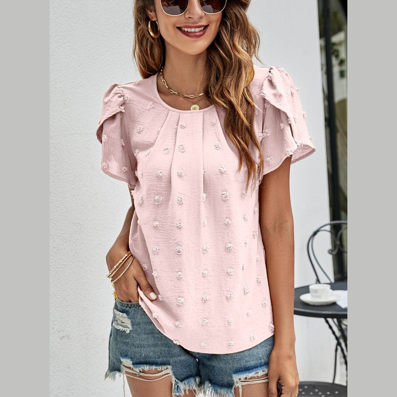 Women's casual pink Swiss dot top with puff sleeves, perfect for casual outings in warm weather