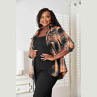 Plus size women's casual vacation shirt in plaid design, perfect for relaxed outings and travel