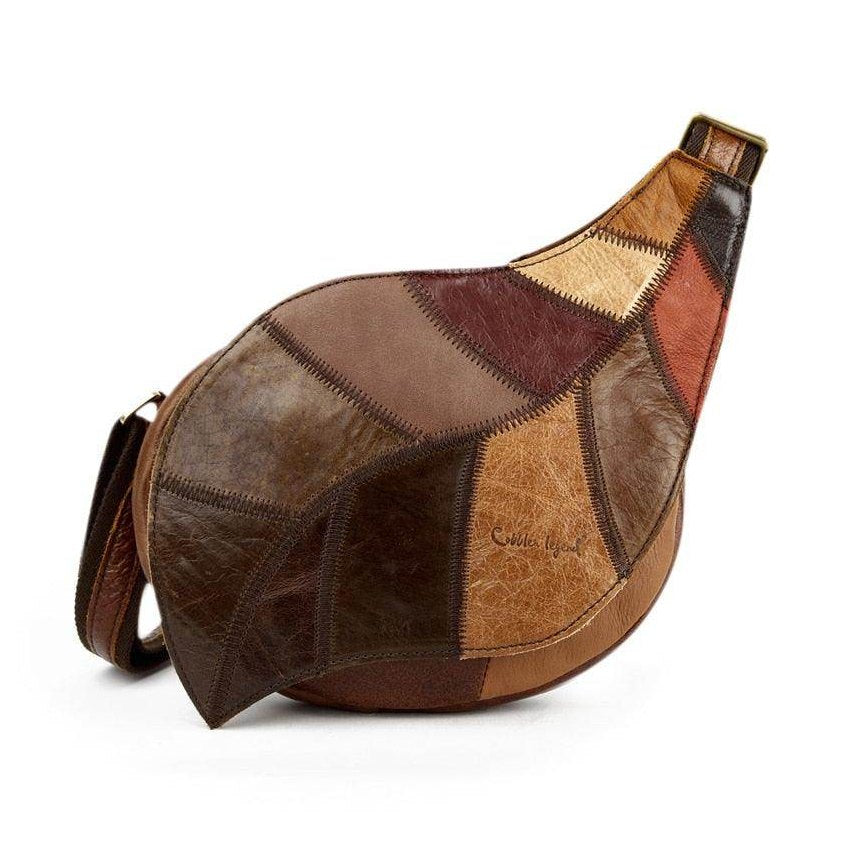 Unique small leather satchel for vacations with a patchwork design in earthy tones