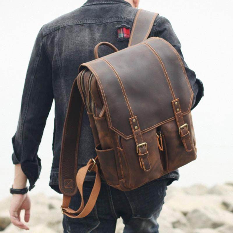 Man wearing a crazy horse leather daypack with adjustable straps, perfect for daily adventures