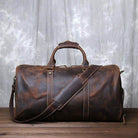Stylish crazy horse leather travel bag with sturdy handles and adjustable shoulder strap