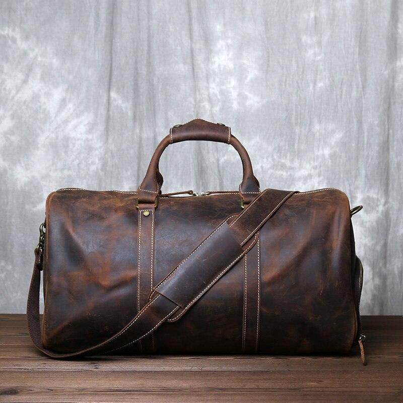 Stylish crazy horse leather travel bag with sturdy handles and adjustable shoulder strap