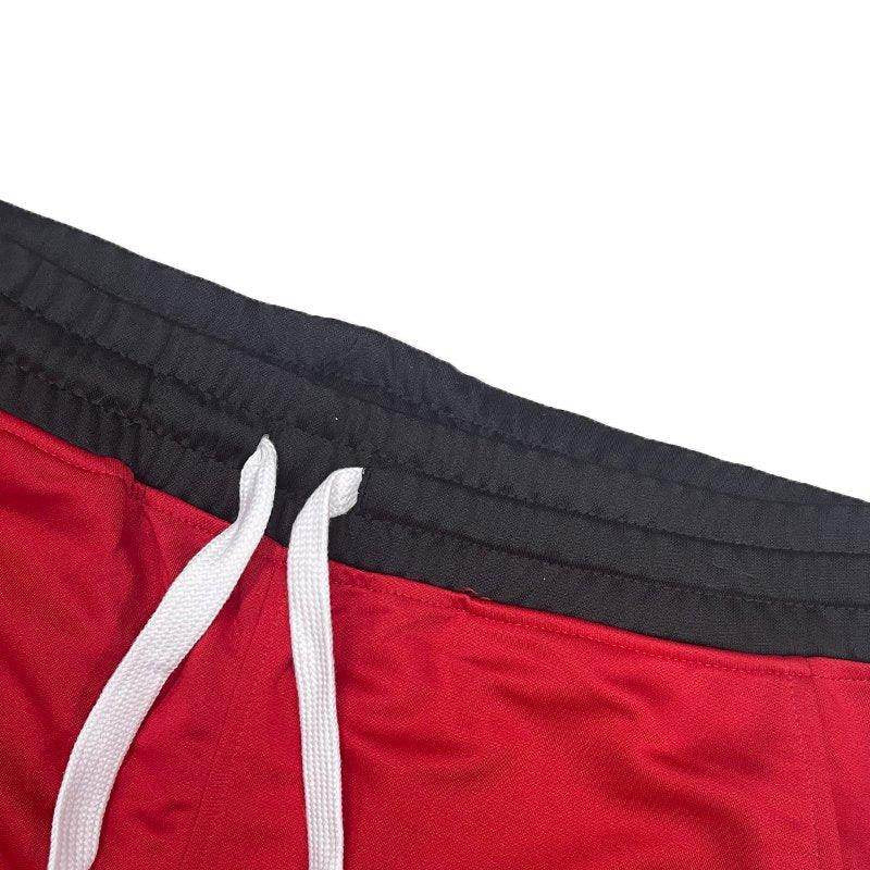 Red drawstring gym shorts from VacationGrabs with elastic waistband and white drawstring