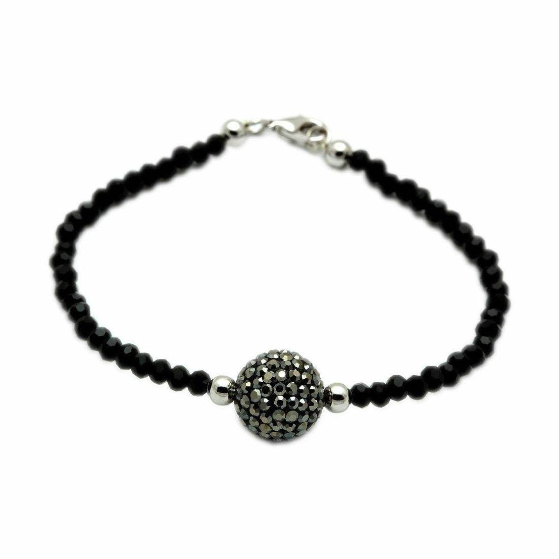 Stylish black beaded bracelet with a decorative centerpiece, ideal for an elegant brass bracelet for vacation outfits