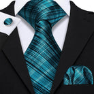 High quality teal tie in plaids, paired with a matching pocket square and cufflinks
