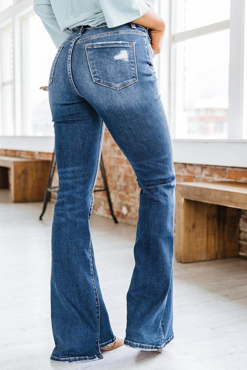 VacationGrabs high rise flare jeans in medium wash featuring a classic fit and stylish pockets