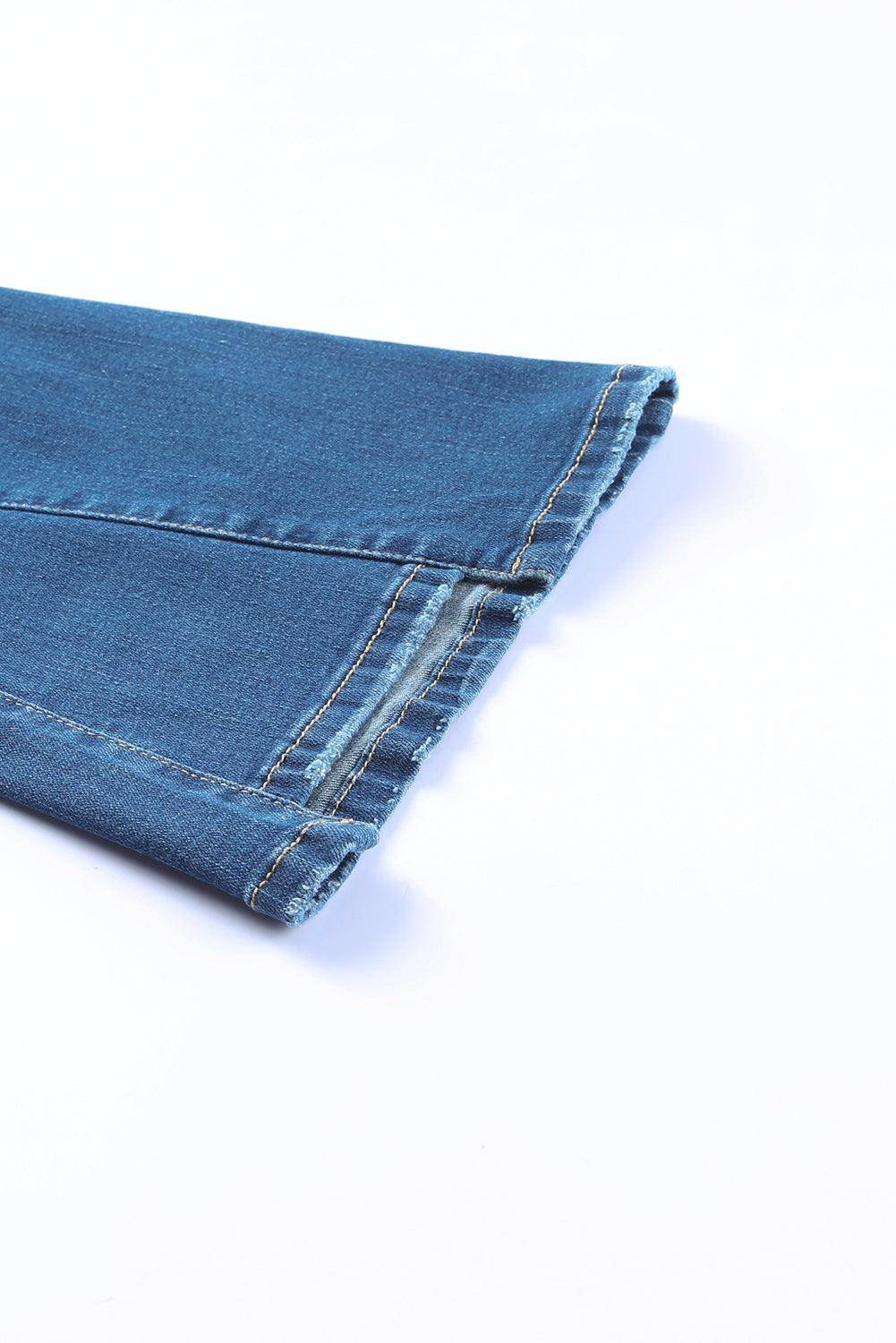 Close-up of Women's high rise flare jeans hemline with a stylish frayed edge from VacationGrabs
