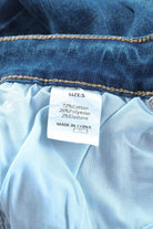 Label of VacationGrabs high rise flare jeans showing fabric composition and size details