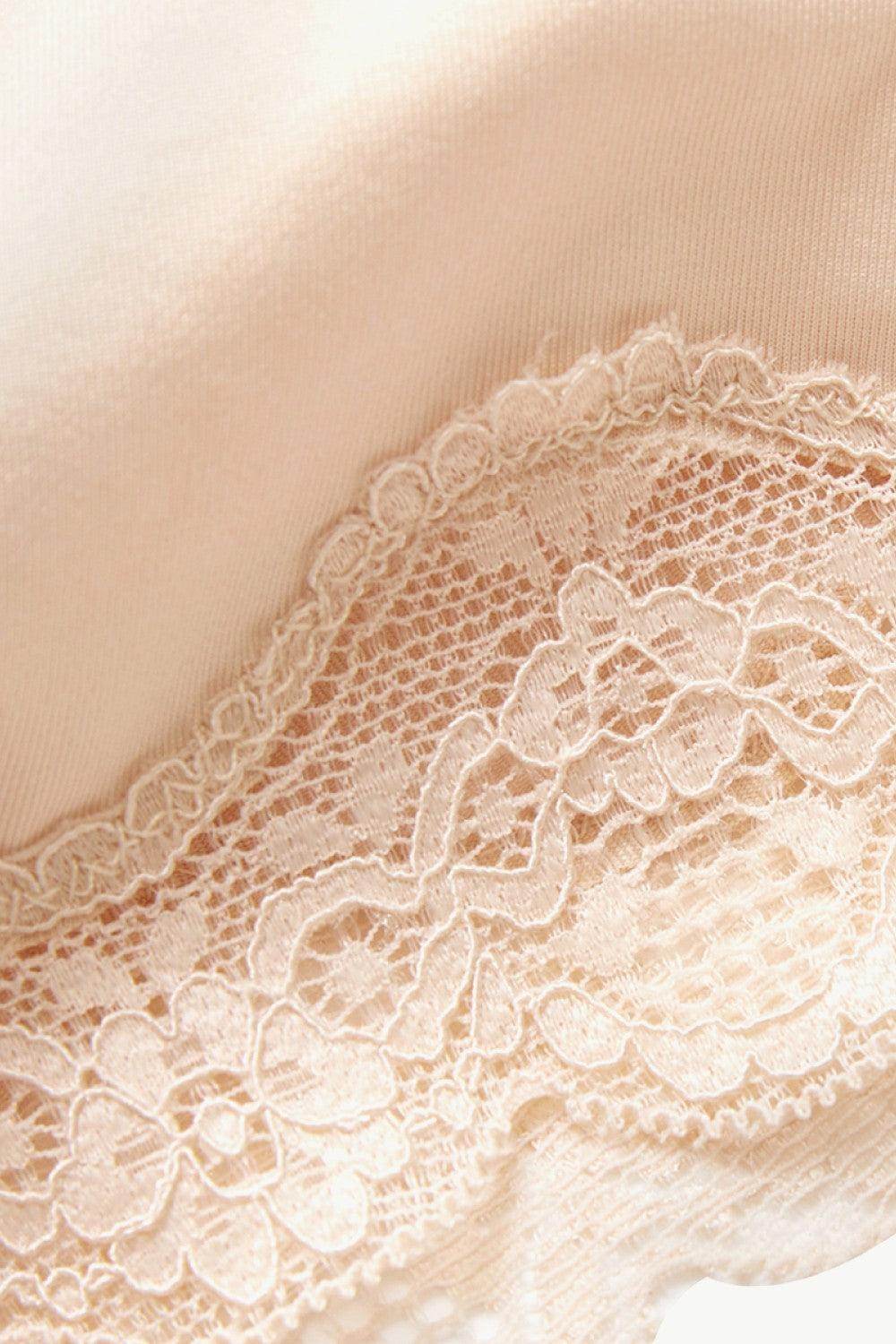 Close-up of women's lace trim shaping shorts featuring delicate lace detailing for added elegance