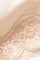 Close-up of women's lace trim shaping shorts featuring delicate lace detailing for added elegance