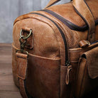 Premium leather travel duffel bag featuring multiple pockets and sturdy zippers