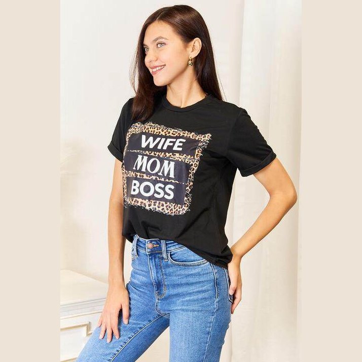 Stylish leopard print mom shirt featuring a bold 'WIFE MOM BOSS' graphic design on a black tee