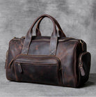 Luxury business travel bag in rich brown leather with multiple compartments for organized packing