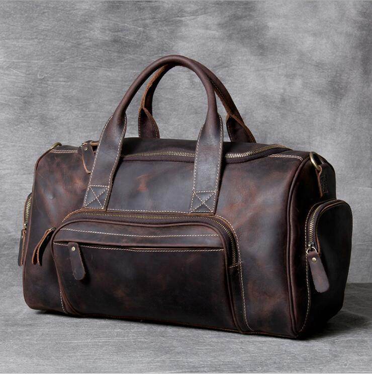 Luxury business travel bag in rich brown leather with multiple compartments for organized packing