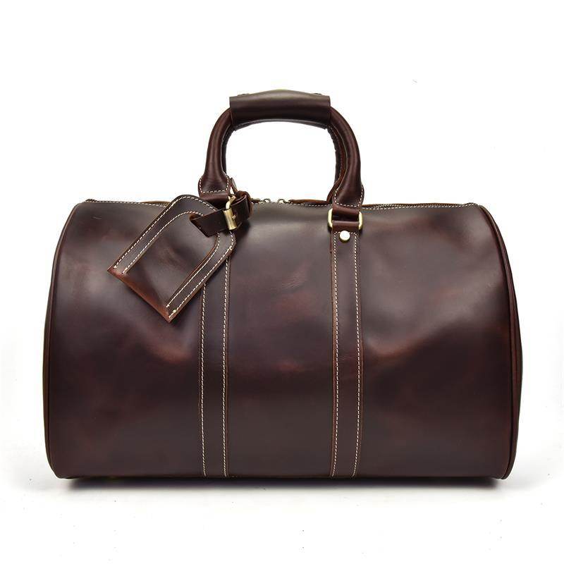 Luxury business travel bag in rich brown leather with sturdy handles and stylish design