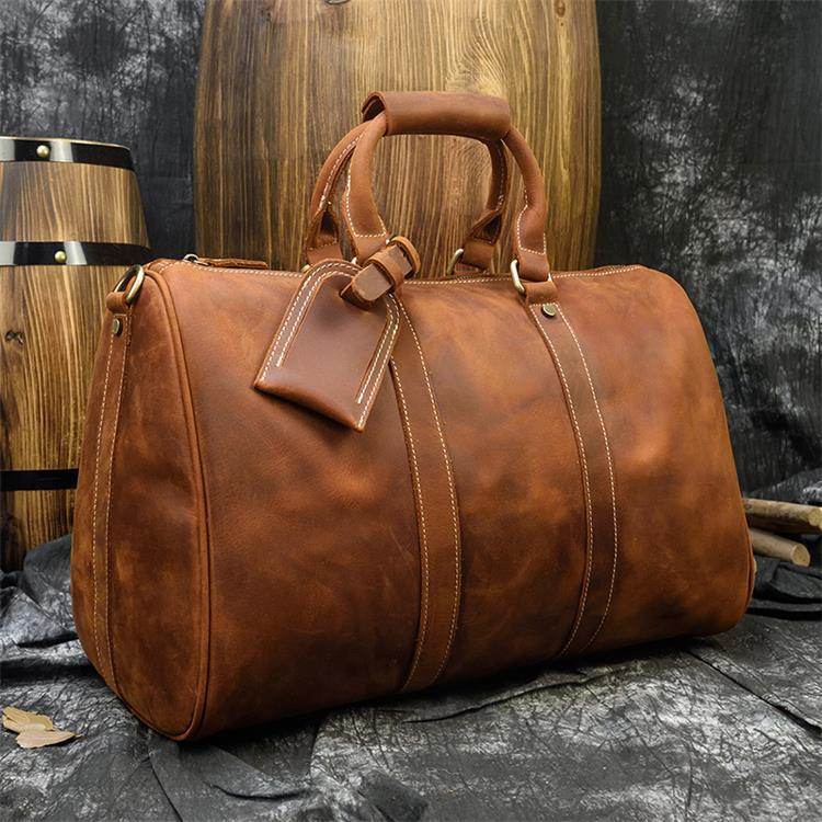 Luxury business travel bag in rich brown leather with stylish design and sturdy handles