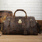 Mens overnight weekender bag in brown crocodile leather with sturdy handles and shoulder strap