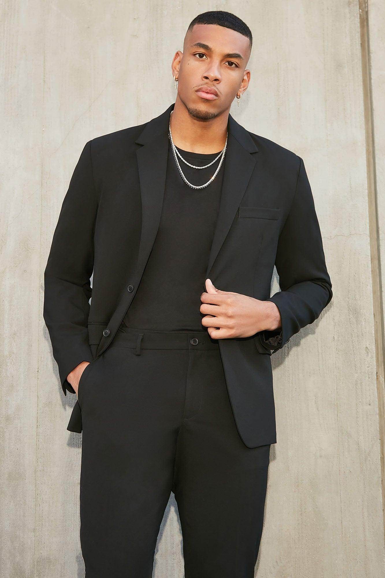 Fashion Nova modern suit jacket for men in black, styled with a matching outfit for a sleek look