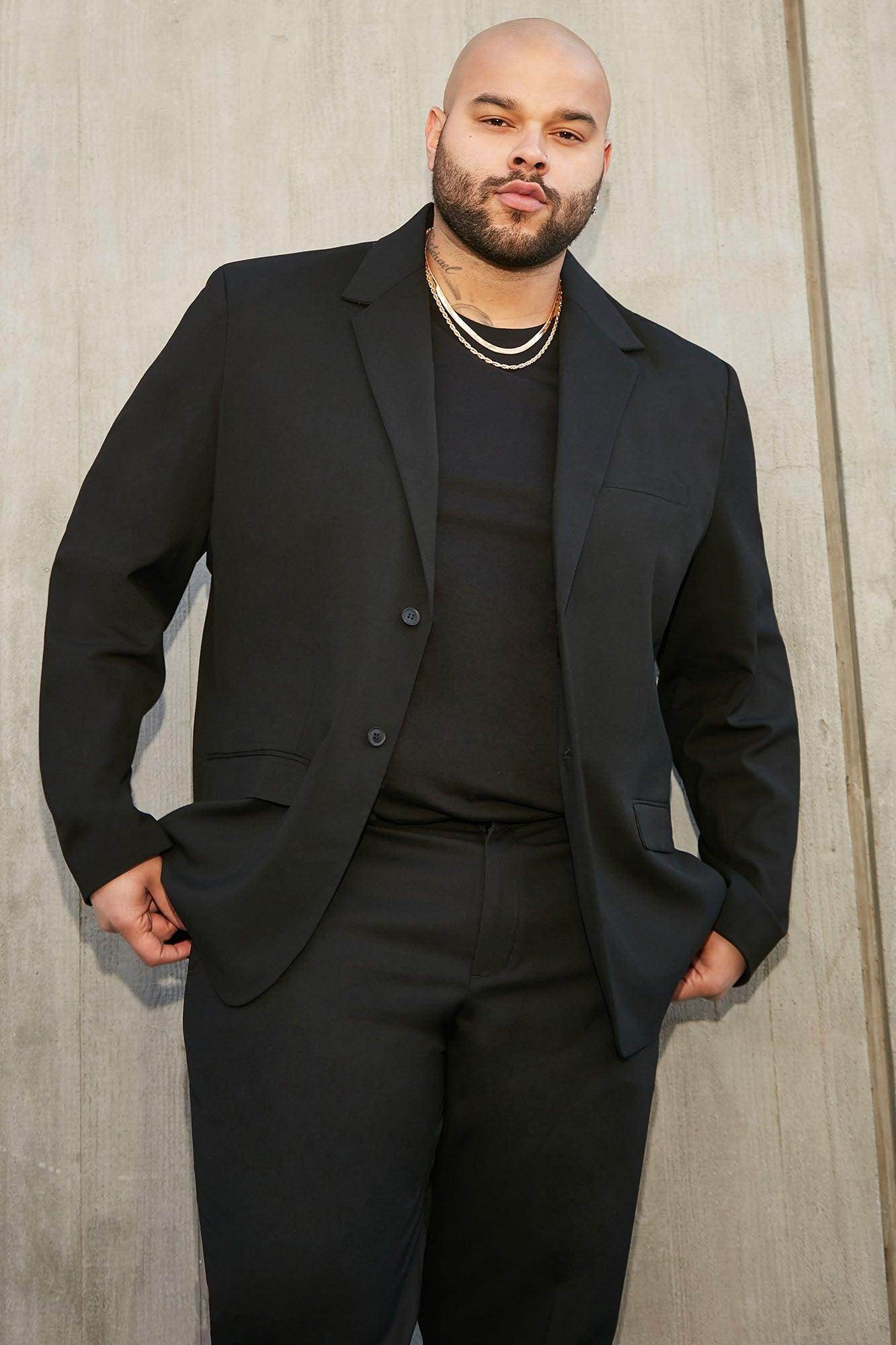 Fashion Nova modern suit jacket for men in black, styled with a relaxed fit and contemporary design