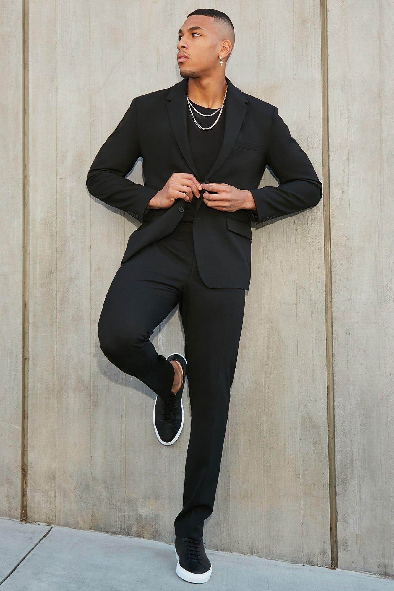 Fashion Nova modern suit jacket for men paired with sleek black pants and stylish sneakers