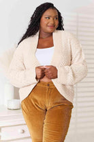 Trendsi open front cardigan for travel in soft beige, perfect for layering during trips