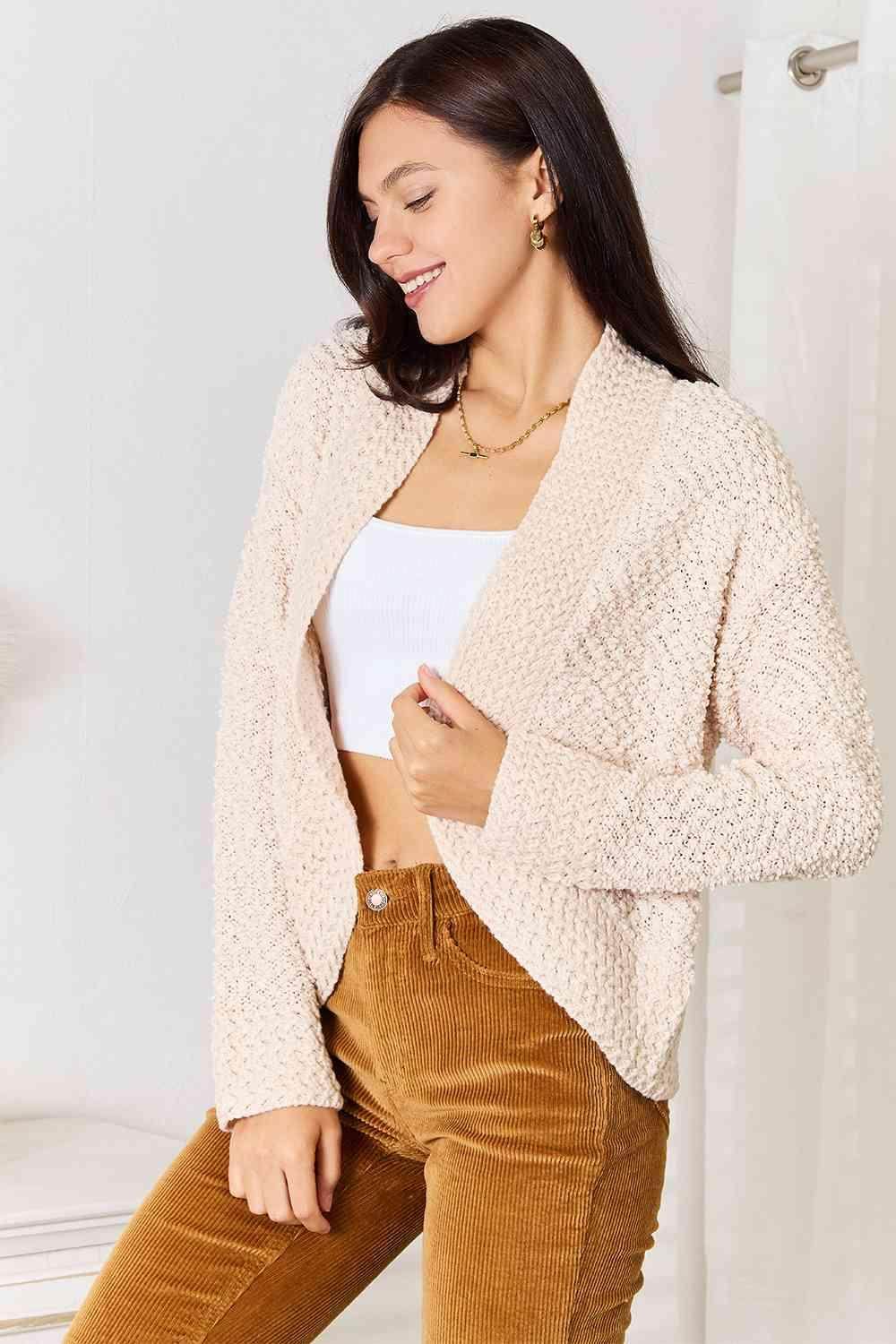 Trendsi open front cardigan for travel in soft beige with a stylish textured design