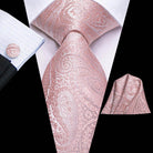Elegant rose gold paisley necktie for weddings paired with matching pocket square and cufflinks