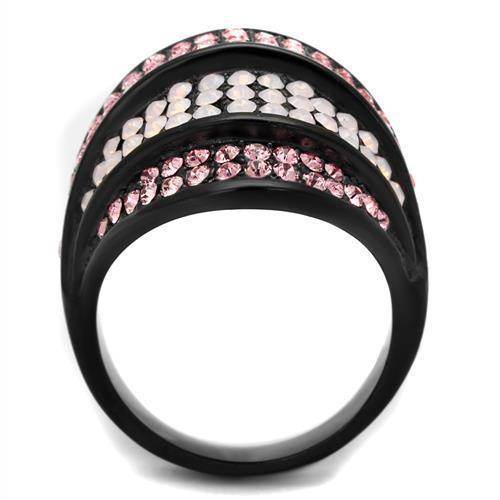 Stylish black ring adorned with pale pink crystal rings and shimmering stones for a chic look