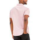 Back view of a pink button down shirt men from VacationGrabs with short sleeves and a modern fit