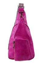Stylish pink PU leather sling bag with a unique design and convenient side pocket