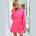 Trendsi pink vacation dress with long sleeves and ruffled hem for stylish summer outings