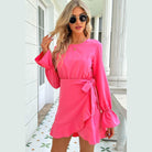 Trendsi pink vacation dress with bell sleeves and a stylish wrap design for summer outings