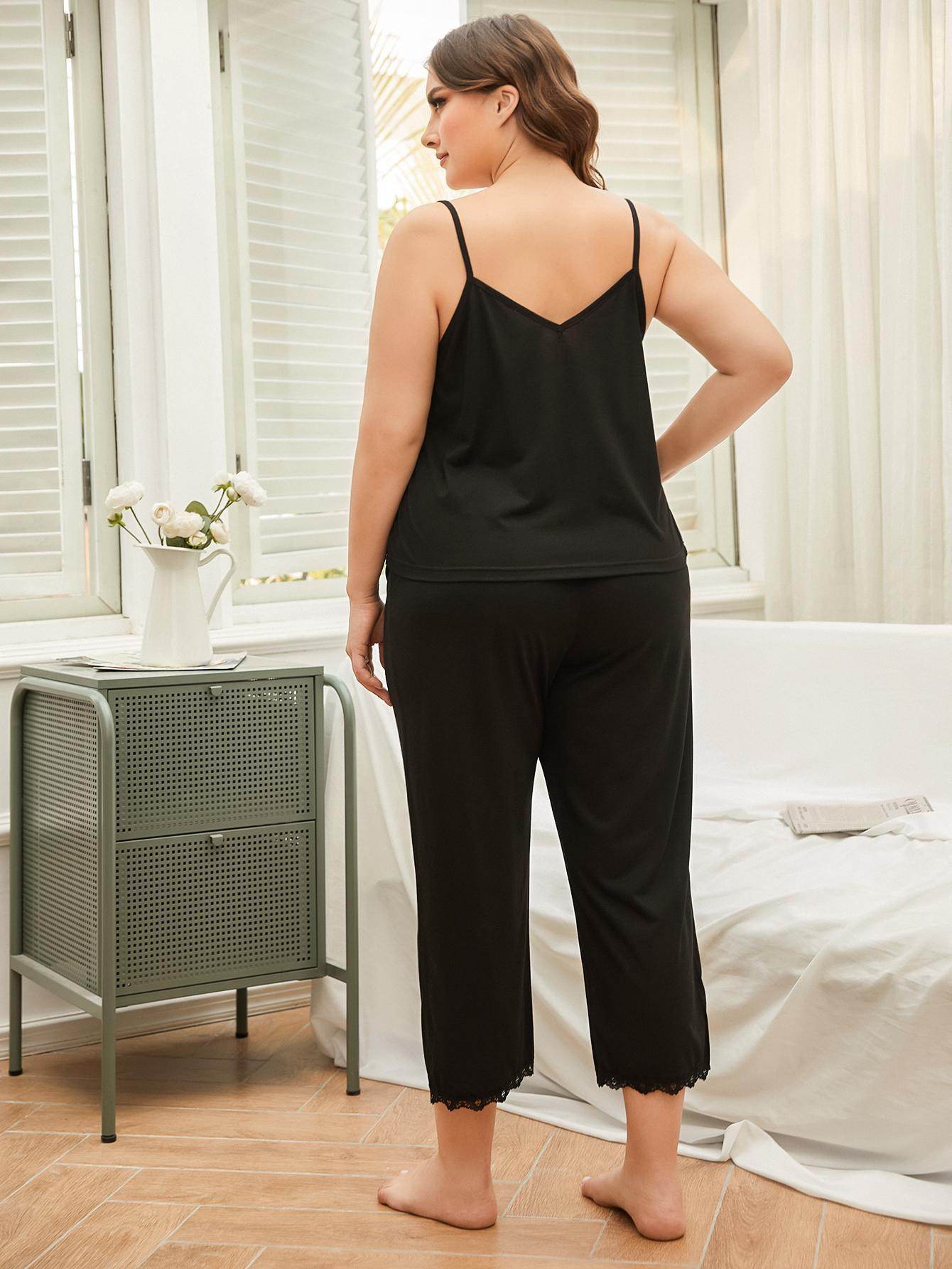 Elegant plus size lace pajama set in black, featuring a comfortable tank top and cropped pants