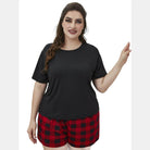 Trendsi Plus Size Lounge Set featuring a black top and red checkered shorts for comfortable home wear