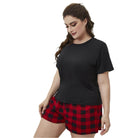 Trendsi plus size lounge set featuring a black top and red plaid shorts for comfortable loungewear