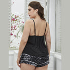 Trendsi plus size scoop neck pajamas featuring a stylish black top and printed shorts for comfortable loungewear.