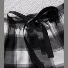Trendsi plus size scoop neck pajamas with black and white plaid pattern and stylish waistband tie