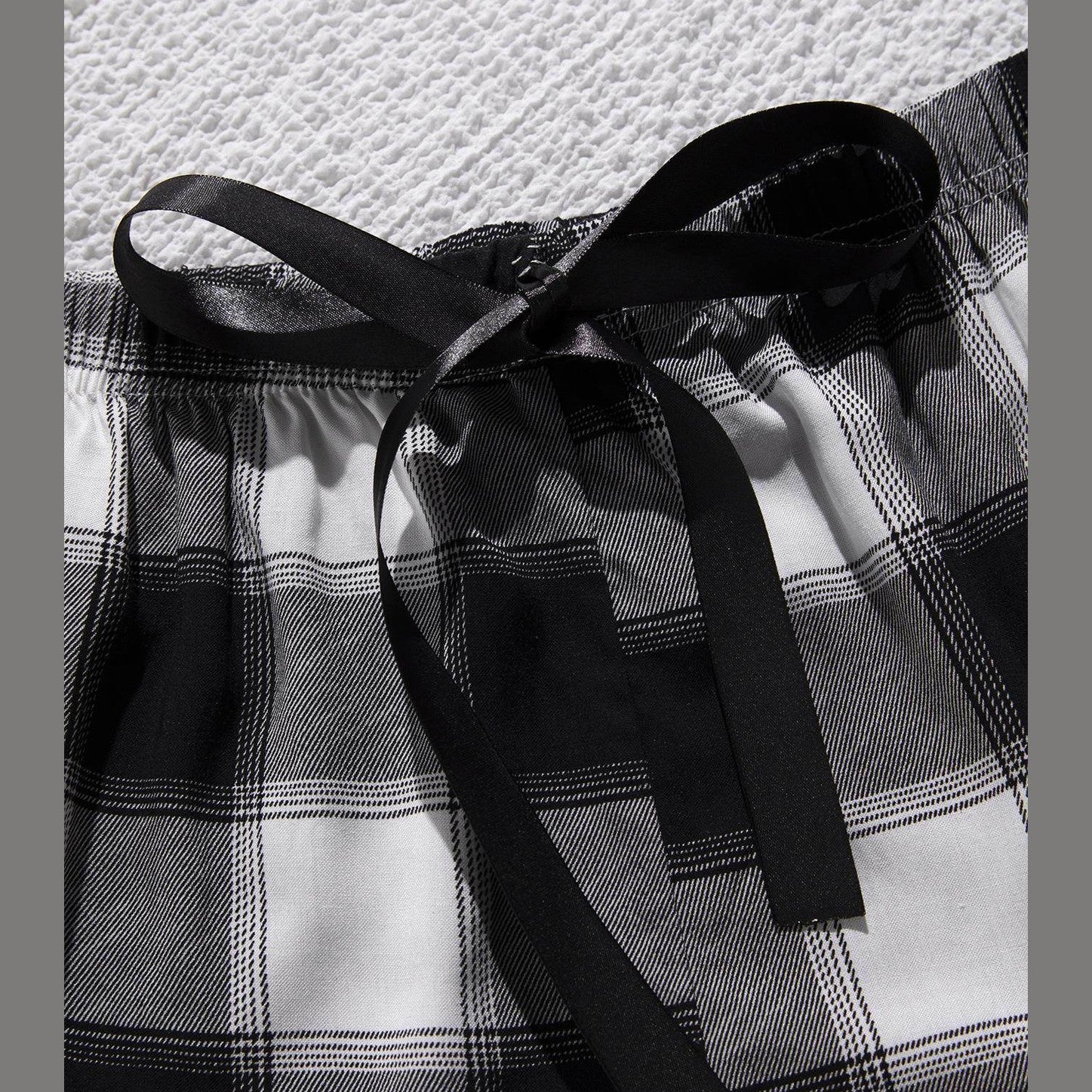 Trendsi plus size scoop neck pajamas with black and white plaid pattern and stylish waistband tie