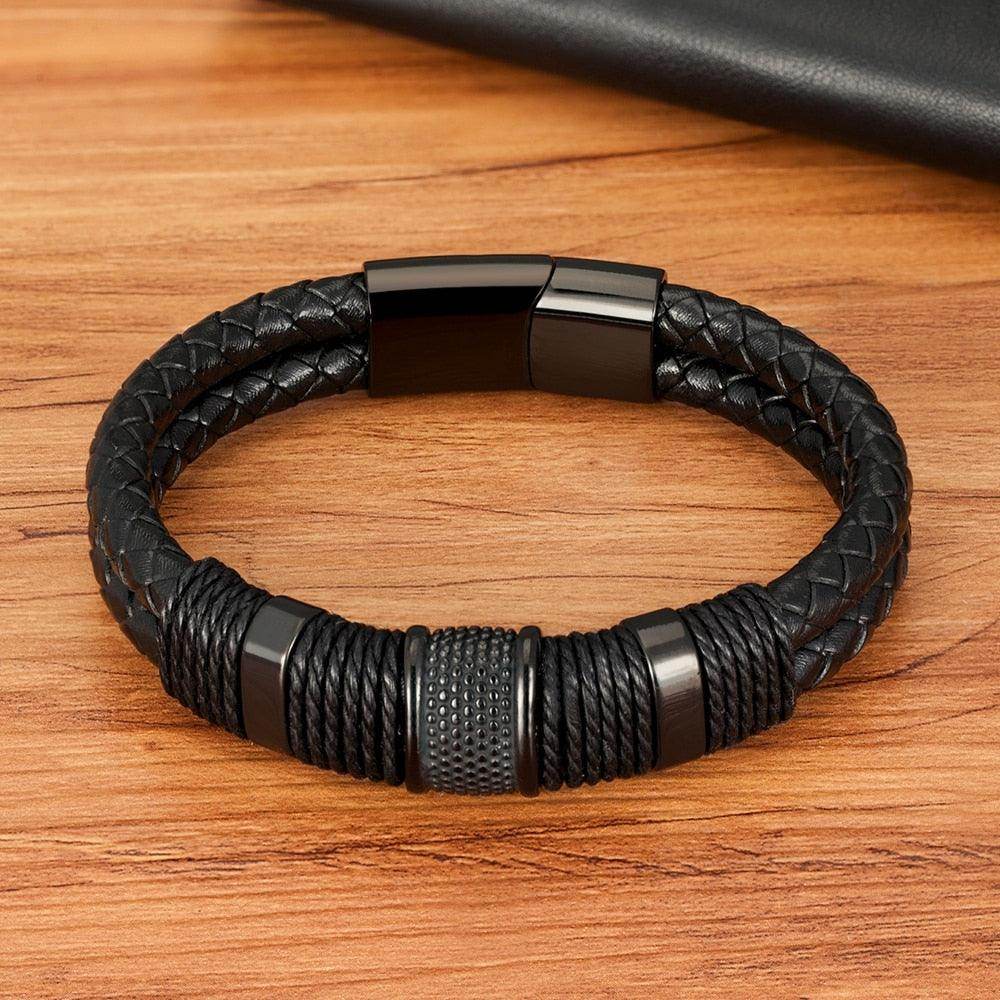 Punk stainless steel bracelet with braided leather and textured accents for men's fashion