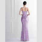 Back view of a stunning purple sequin dress women with a fitted silhouette and spaghetti straps