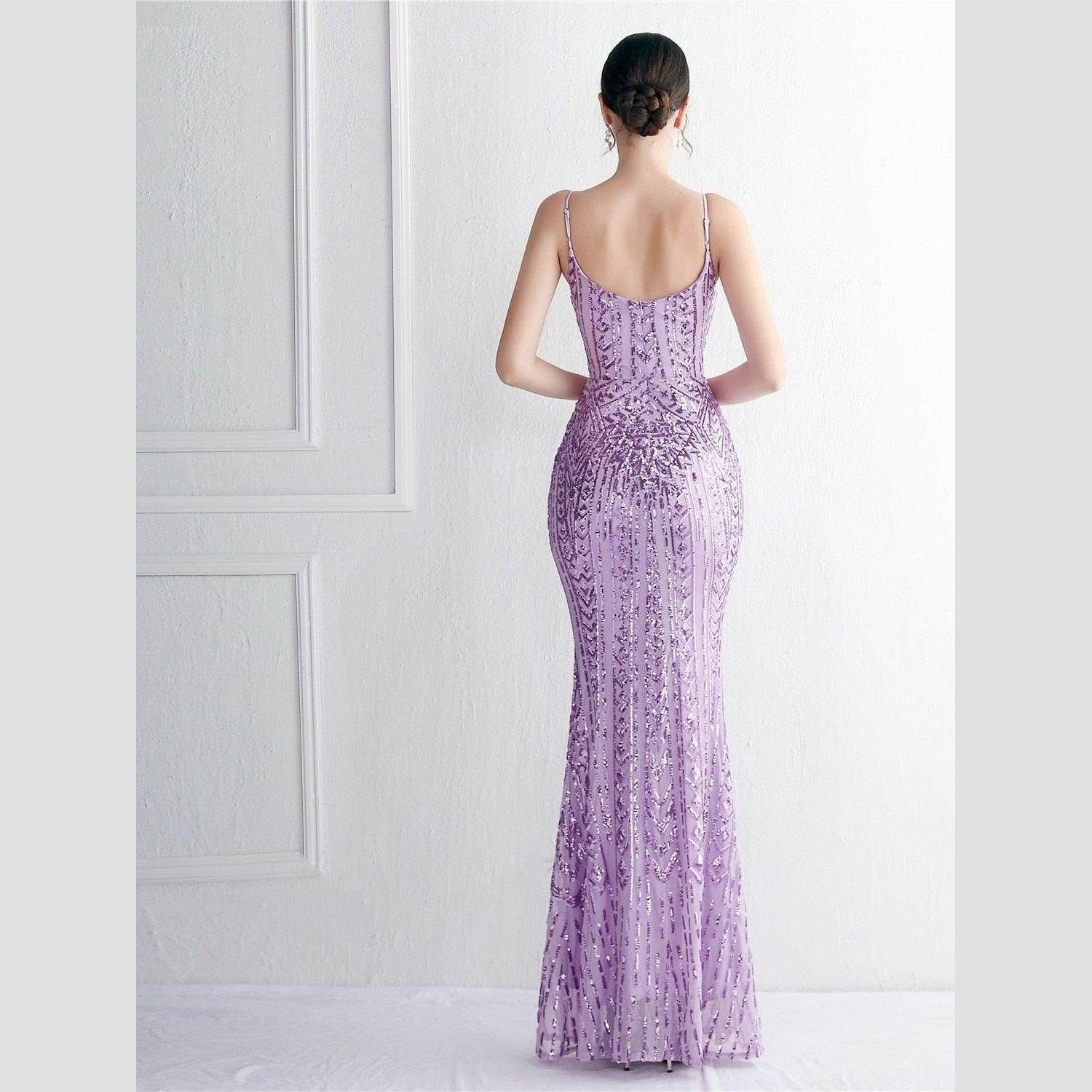 Back view of a stunning purple sequin dress women with a fitted silhouette and spaghetti straps