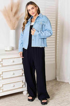 Trendsi raw hem denim jacket styled over a black outfit for a trendy casual look