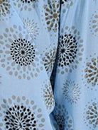 Light blue women's ruched full size pants with decorative floral print design for stylish comfort