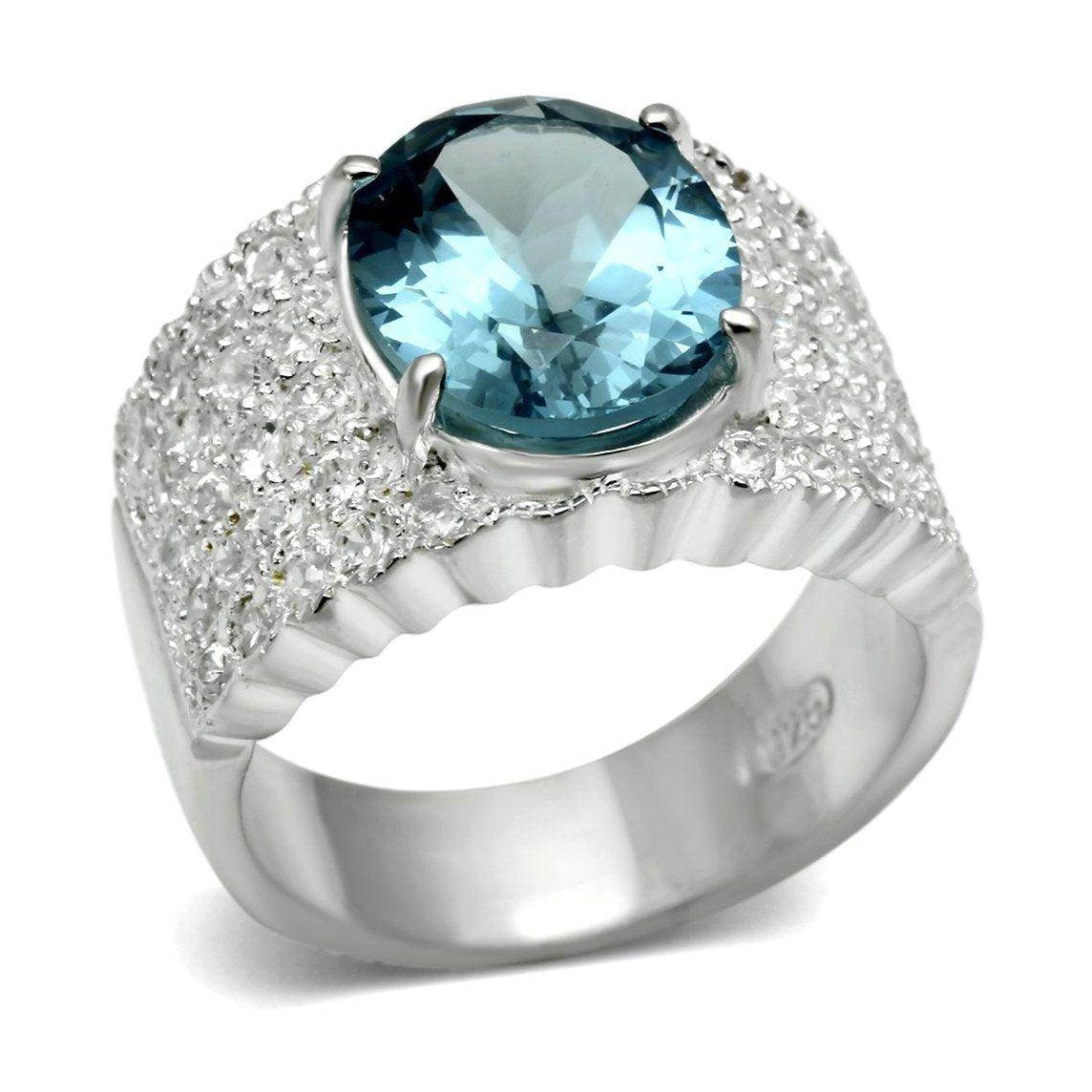 Stunning silver fashion ring for vacation featuring a large blue gemstone and sparkling details